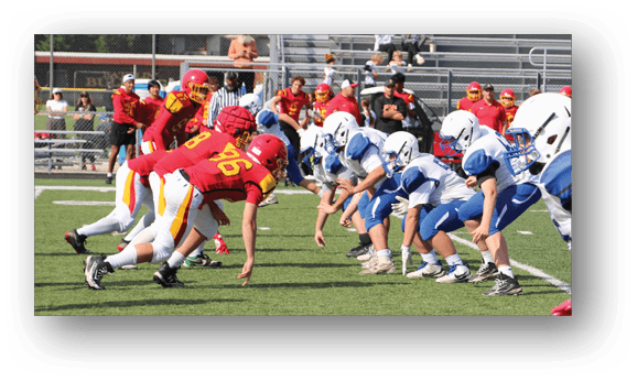 A group of football players on a field. Description generated by AI