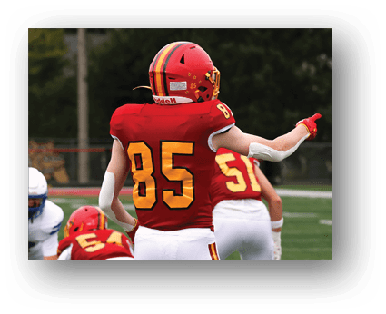 A group of football players on a field. Description generated by AI