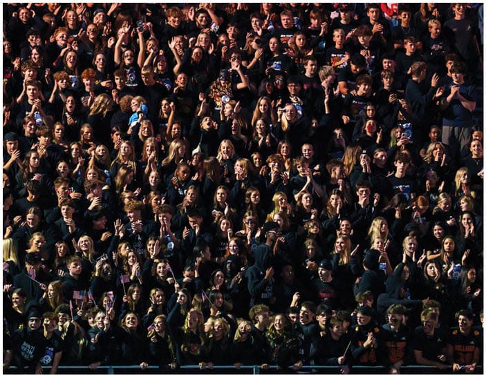 A group of football players on a field. Description generated by AI