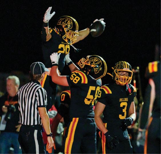 A group of football players celebrating a victory. AI generated content