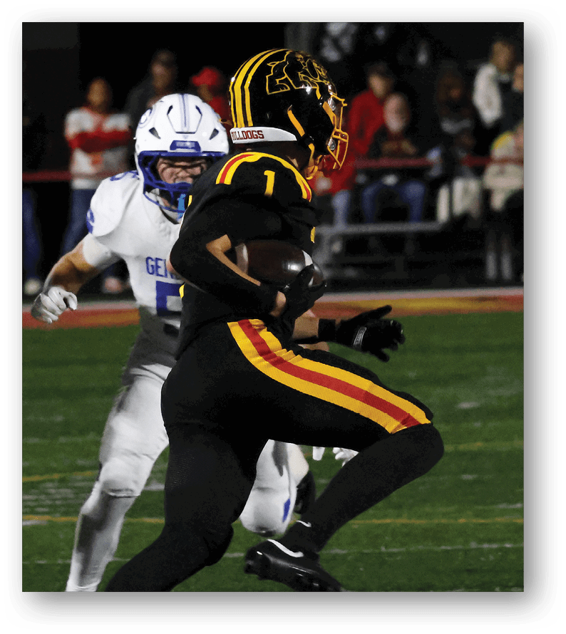 A group of football players on a field. Description generated by AI
