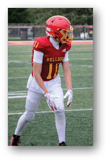 A football player catching a ball. Description generated by AI