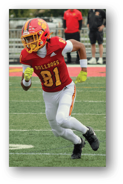 A football player catching a ball. Description generated by AI