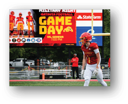 A group of football players on a field. Description generated by AI