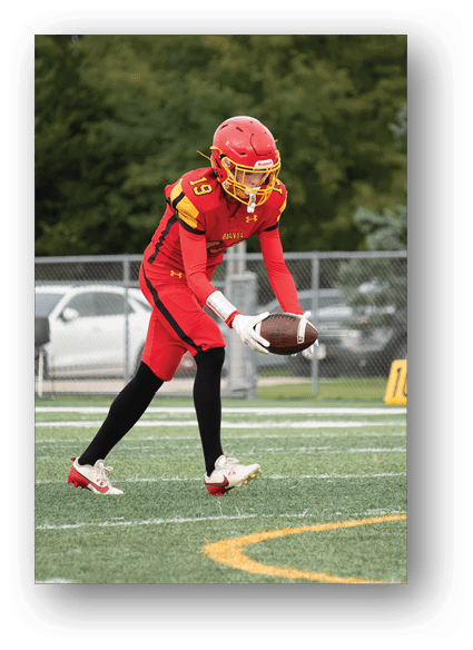 A football game is being played on a field. Description generated by AI
