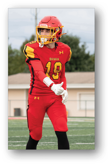 A football player catching a ball. Description generated by AI