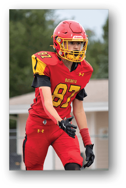 A football player catching a ball. Description generated by AI