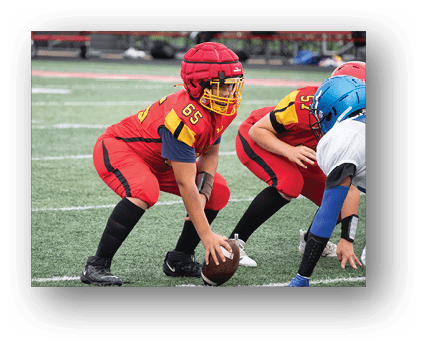 A group of football players on a field. Description generated by AI