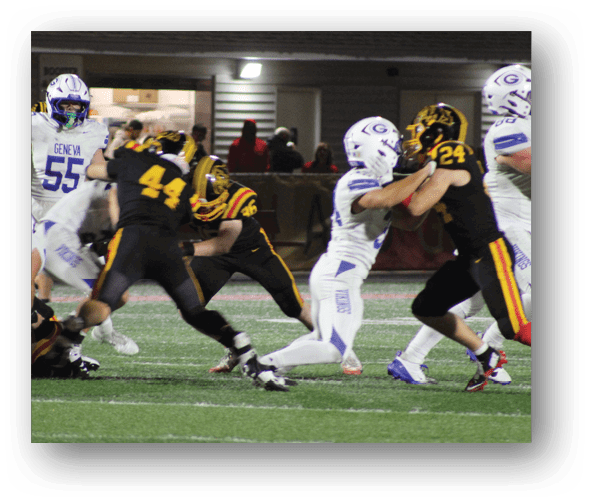 A group of football players celebrating a touchdown. Description generated by AI