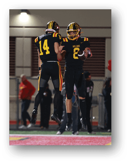 Two football players wearing blue and white uniforms. Description generated by AI