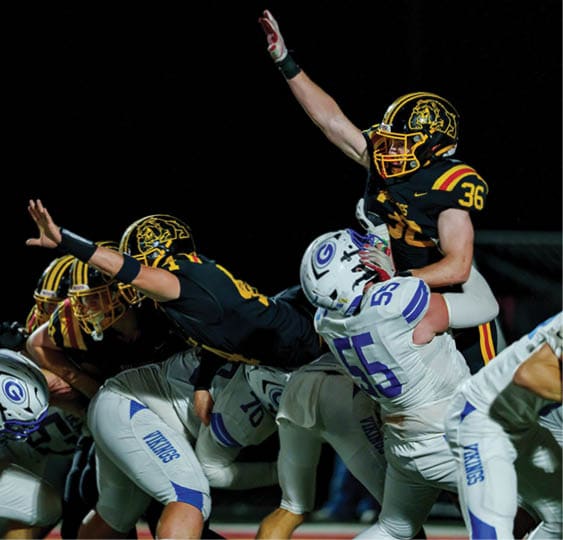 A group of football players celebrating a victory. AI generated content