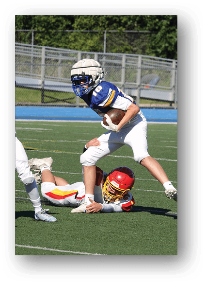 A football game is being played on a field. Description generated by AI