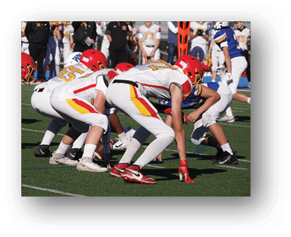 A group of football players on a field. Description generated by AI