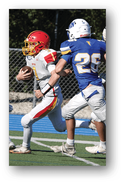 A football player catching a ball. Description generated by AI