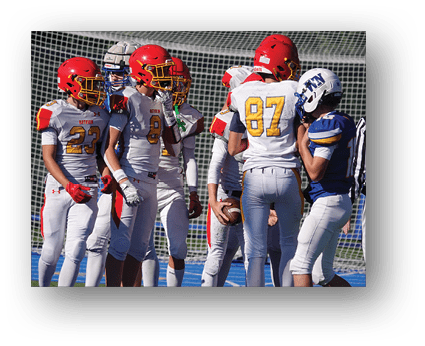 A group of football players on a field. Description generated by AI