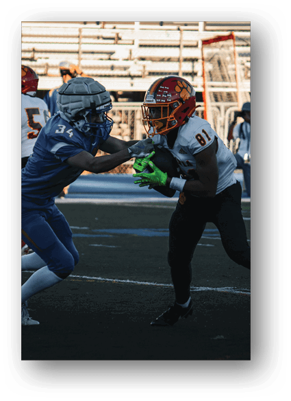 A football game is being played on a field. Description generated by AI