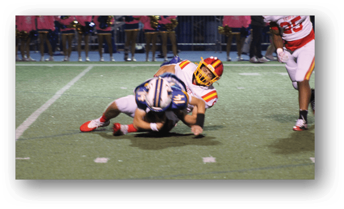 A group of football players on a field. Description generated by AI