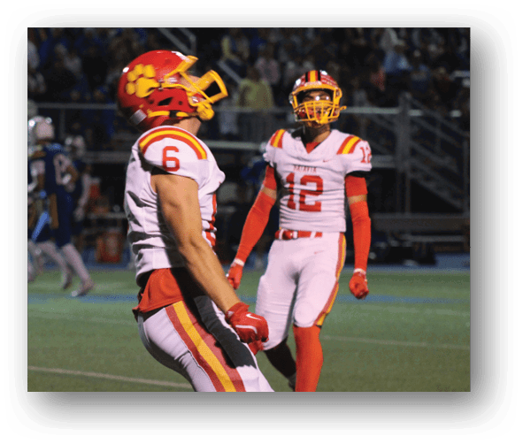 A group of football players celebrating a touchdown. Description generated by AI