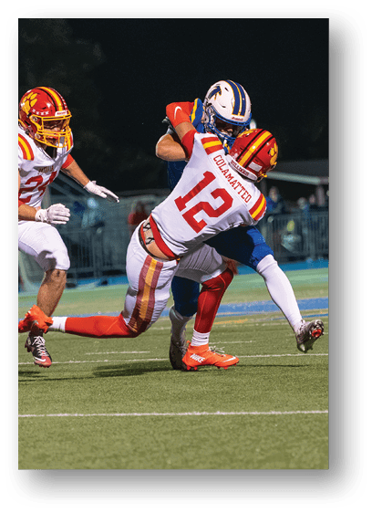 A group of football players celebrating a touchdown. Description generated by AI
