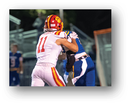 A football player running on the field. Description generated by AI