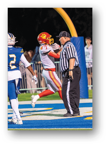 A group of football players celebrating a touchdown. Description generated by AI