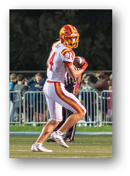 A group of football players celebrating a touchdown. Description generated by AI