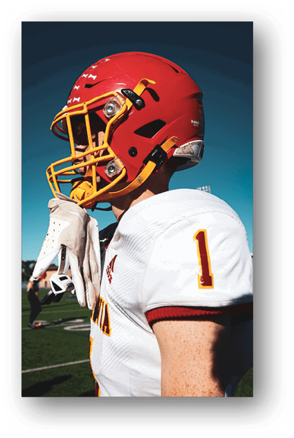 A football player catching a ball. Description generated by AI