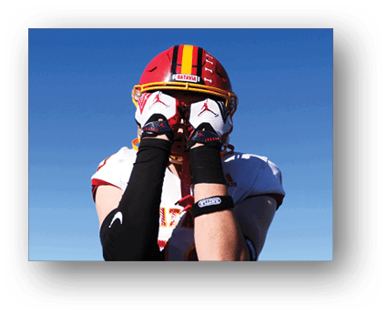 A group of football players on a field. Description generated by AI