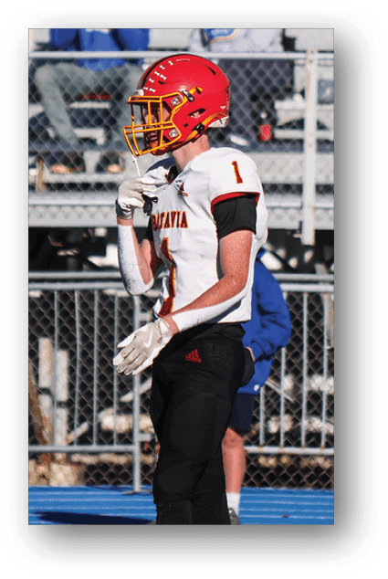 A football player catching a ball. Description generated by AI