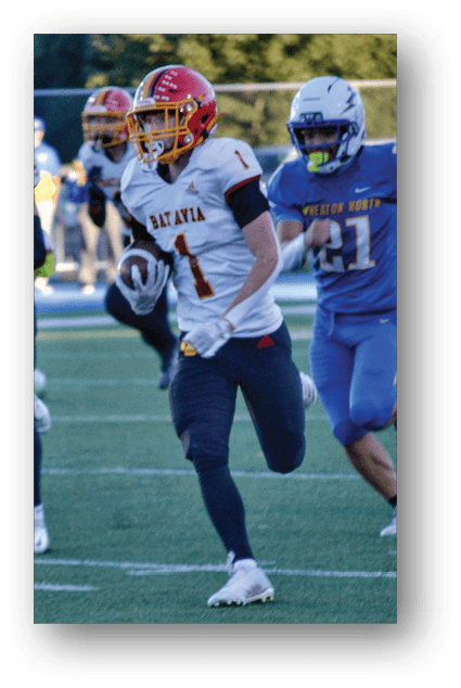 A football player catching a ball. Description generated by AI