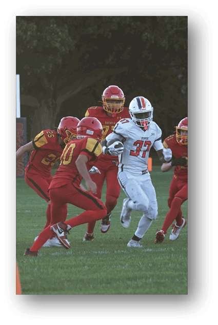 A football player catching a ball. Description generated by AI