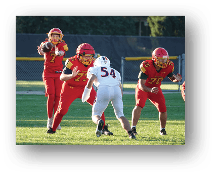 A group of football players on a field. Description generated by AI