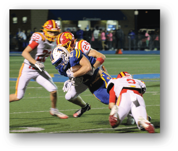 A group of football players celebrating a touchdown. Description generated by AI