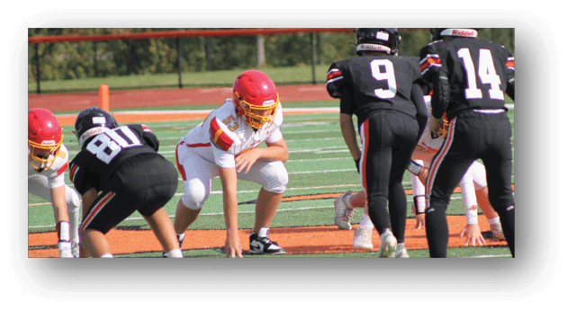 A football player wearing a blue and white uniform. Description generated by AI