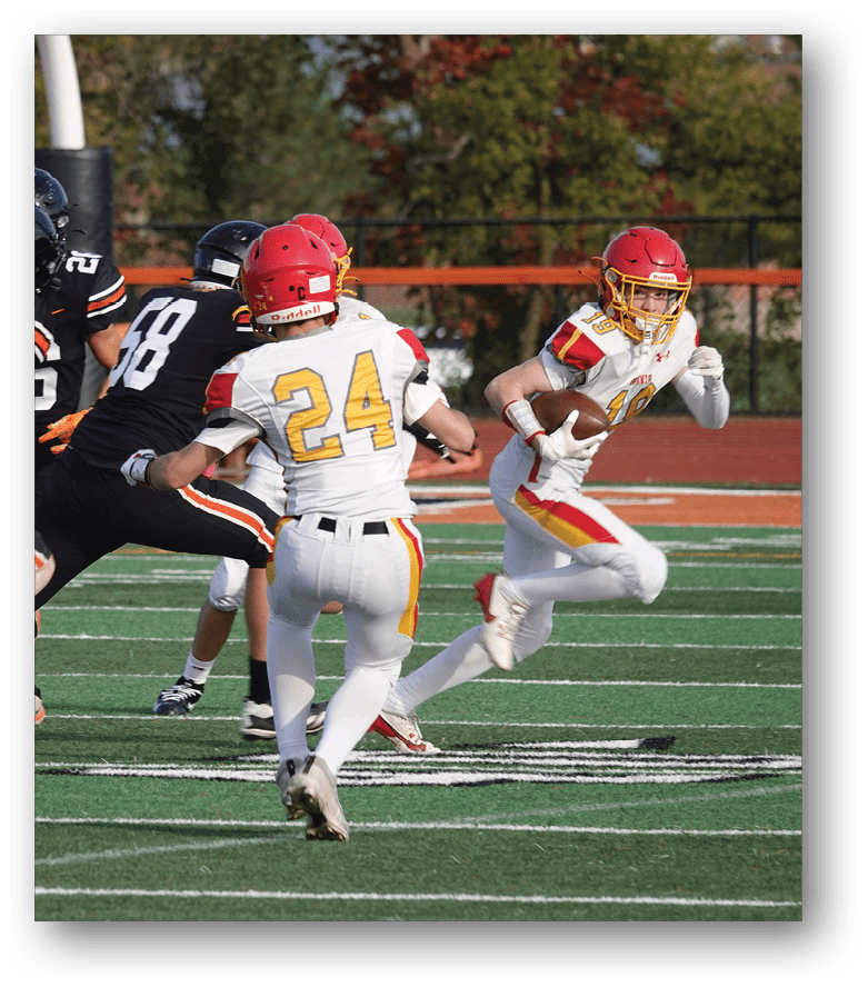 Three football players in blue and white uniforms running on a field. Description generated by AI