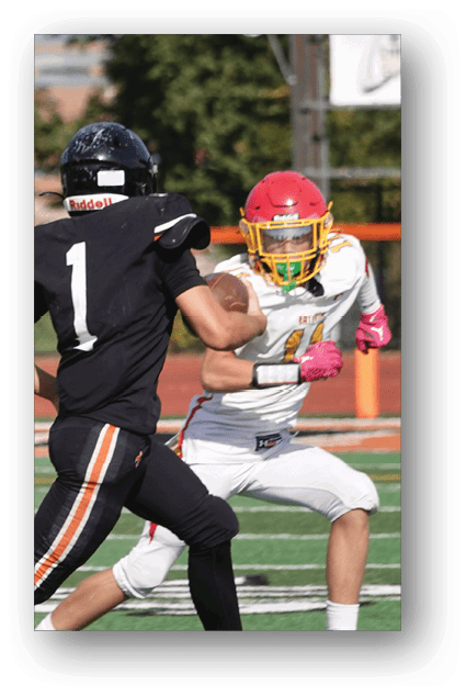 A football player catching a ball. Description generated by AI