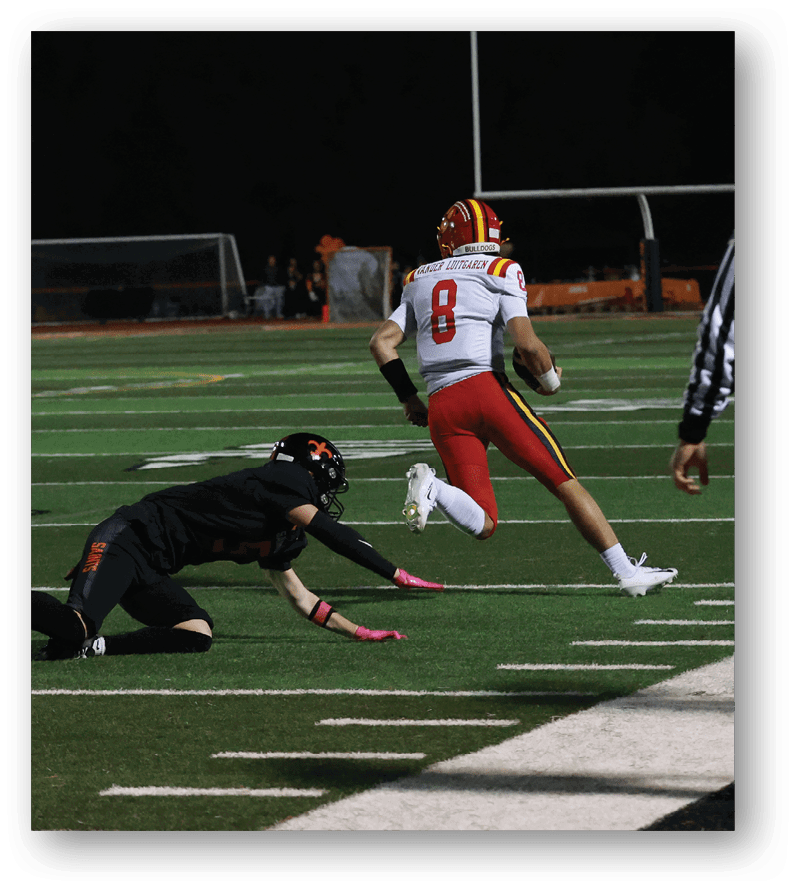A group of football players on a field. Description generated by AI