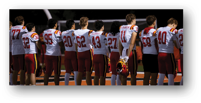 A group of football players on a field. Description generated by AI