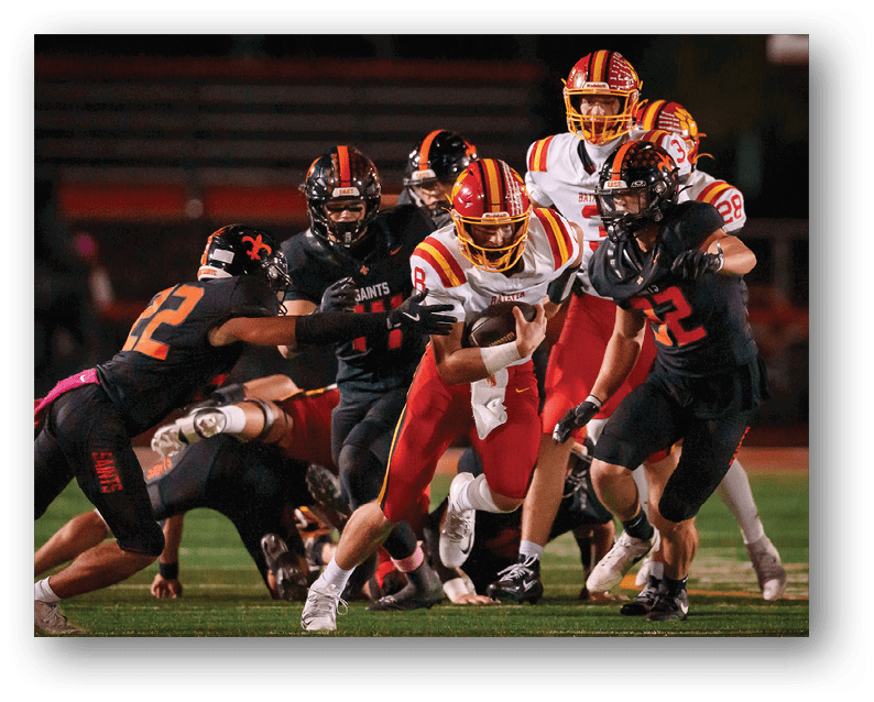 A group of football players on a field. Description generated by AI