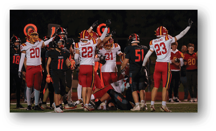 A group of football players on a field. Description generated by AI