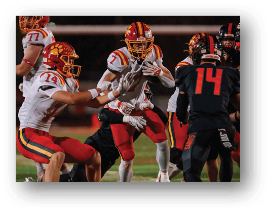 A football player running on the field. Description generated by AI