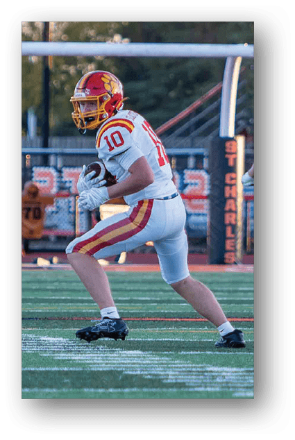 A football player catching a ball. Description generated by AI