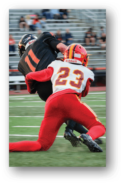 A football player catching a ball. Description generated by AI