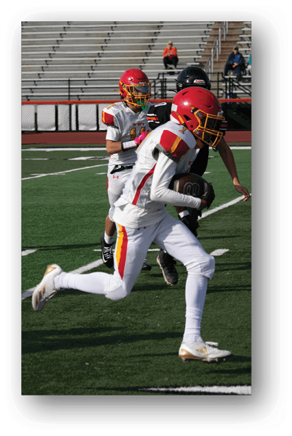A football player catching a ball. Description generated by AI
