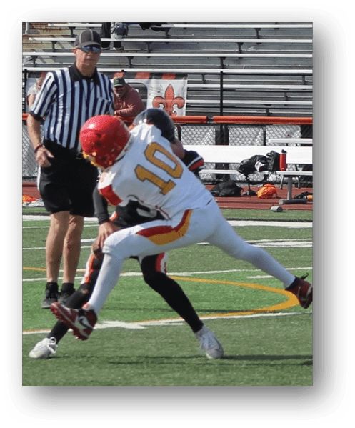 A football player catching a ball. Description generated by AI
