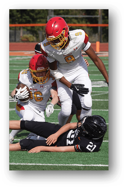 A football player catching a ball. Description generated by AI
