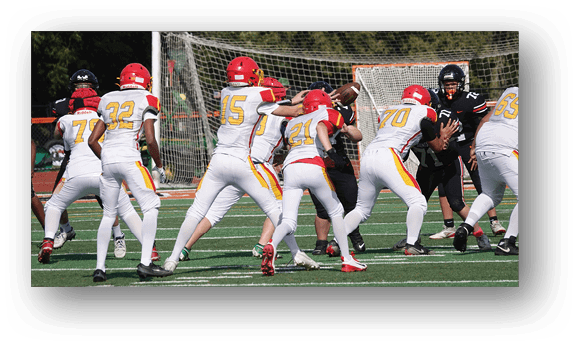 A group of football players on a field. Description generated by AI