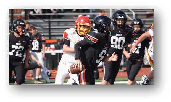 A group of football players on a field. Description generated by AI