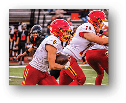 A group of football players on a field. Description generated by AI