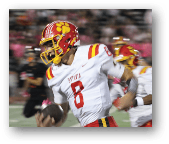 A group of football players celebrating a touchdown. Description generated by AI